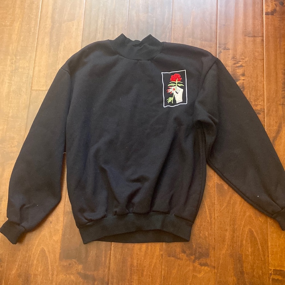 hand holding rose embroidered sweatshirt - Picture 1 of 2